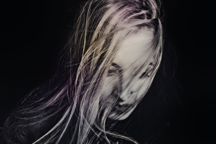 photodune-650072-woman-with-hair-fluttering-in-wind-closeup-xl-1030×686-min